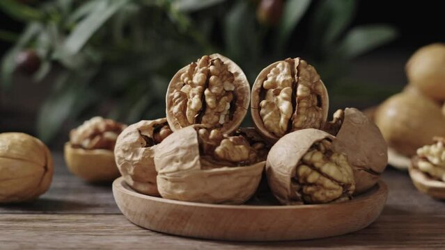Walnuts are placed on a rustic old wooden table