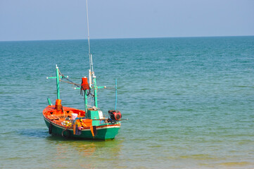 Fototapeta premium Long tail boat Fishing boat at the seashore Traditional fishing boats in the area Hua Hin Thailand