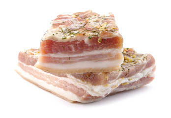 Appetizing salty lard with layers of meat with garlic and herbs. Two pieces of salted lard isolated on a white background.