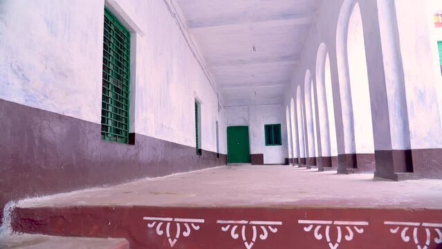 An old zamindar house in a district of West Bengal.
A mid-shot footage of the renovated mansion and its corridor.