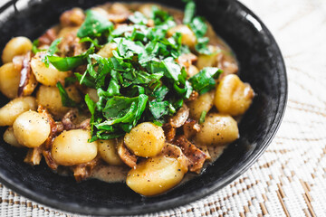 plant-based gnocchi with mock meat chicken and fresh herbs
