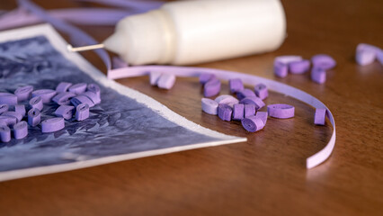 Creative Process of Quilling: Making a Purple-Painted Greeting Card with Paper Strips