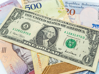 Obraz na płótnie Canvas venezuelan money bolivars and US dollar currency