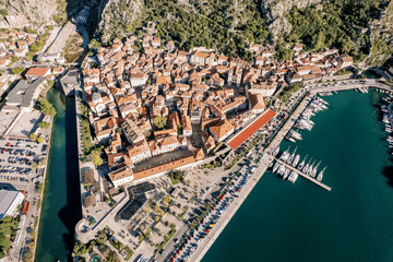 Yachts are moored off the coast of the ancient town. Kotor, Montenegro. Drone