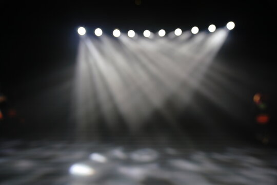 Defocused entertainment concert lighting on stage, blurred disco party and Concert Live.