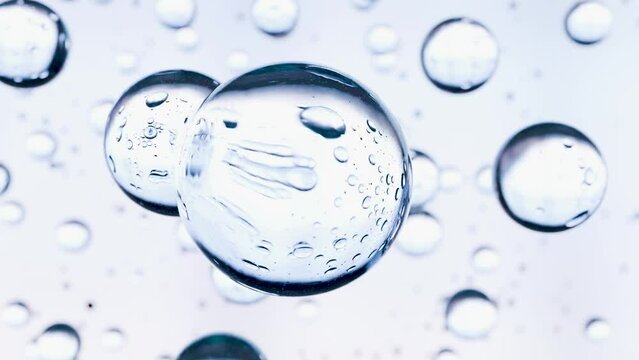 essential Oil Bubbles for cosmetics in water. blue liquid bubbles, fluid flow. Collagen, atoms floating, Moisturizing Cream, Skin Serum, Vitamin, beauty concept, 3d render	
