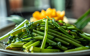 Thai herb stir fry morning glory or water spinach. Served with pineapple and mango.