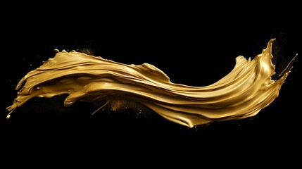 Beautiful textured golden brush stroke on black background. Luxurious and shiny gold paint stroke.