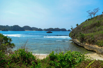 Beautiful Beach with white sand and clear skyline in Malang