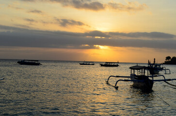 The beauty of Senggigi Beach at sunset with boats that decorate the beautiful beachfront