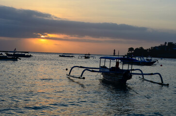 The beauty of Senggigi Beach at sunset with boats that decorate the beautiful beachfront