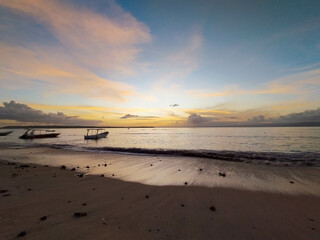 The view of the sunset in Nusa Penida is very beautiful and enchanting with an orange sky