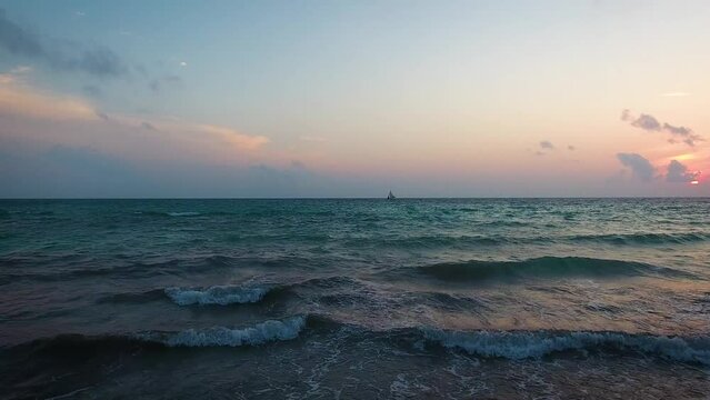 Aerial view of a tropical beach during sunset