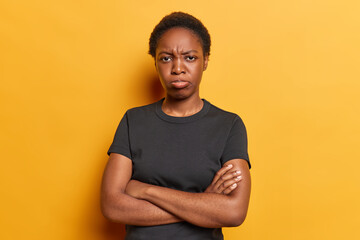 People negative emotions concept. Studio shot of young upset dissatisfied African american female...