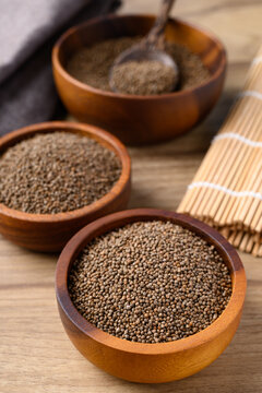 Perilla seed in wooden bowl, Healthy herbal seed ingredients in Asian food © nungning20