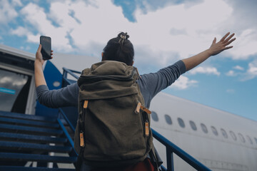 Happy attractive asian woman traveler with backpack at the modern airport terminal, copy space, Tourist journey trip concept