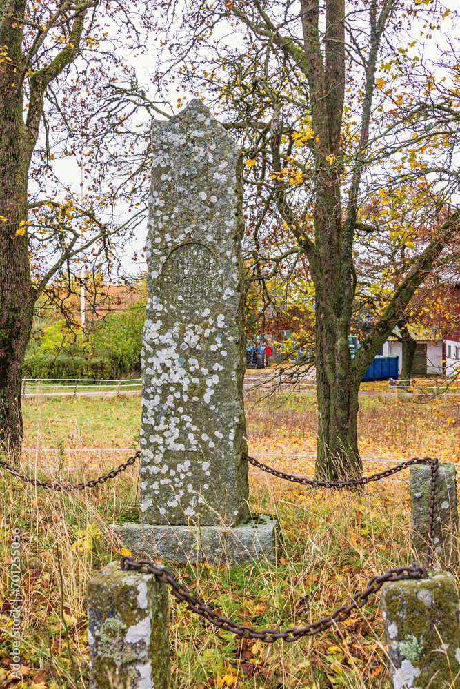 Wall mural Memorial site after an old church at autumn