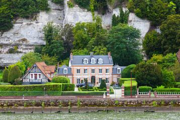 The coast of the Seine River in France in the suburbs of Rouen with beautiful private houses and...