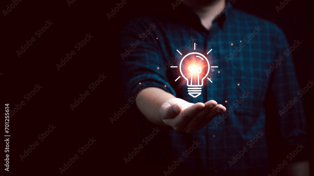 Poster businessman holding glowing lightbulb drawing with copy space for creative thinking idea and problem