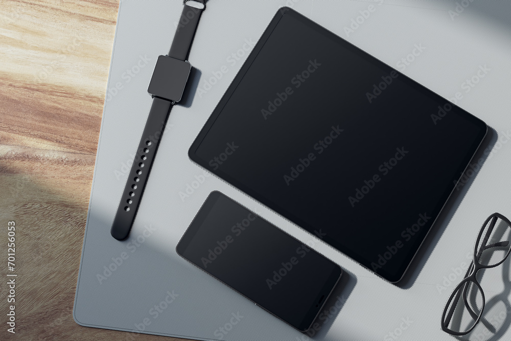Poster top view of empty tablet and smartphone screen, digital watch, pen and glasses on wooden tablet. dev