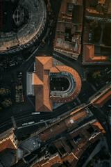 Aerial top down drone shot of a roundabout with old roman style building in Verona, Italy