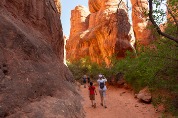 Man Hiking Red Mountains in Fiery Furnace, Utah