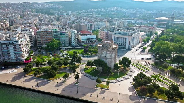 Aerial View of Landmark Ottoman Fortress White Tower of Thessaloniki. Waterfront of the city of Thessaloniki, Whitewashed Tower, Greek port city with tall buildings in Greece.