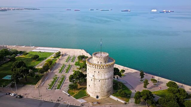 Aerial View of Landmark Ottoman Fortress White Tower of Thessaloniki. Waterfront of the city of Thessaloniki, Whitewashed Tower, Greek port city with tall buildings in Greece.