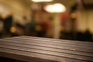 image of a wooden table on a blurred bokeh background