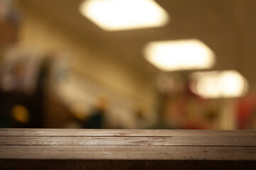 image of a wooden table on a blurred bokeh background