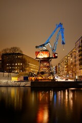 Fototapeta na wymiar Old crane in Stockholm (Sweden) beautifully lit during the night