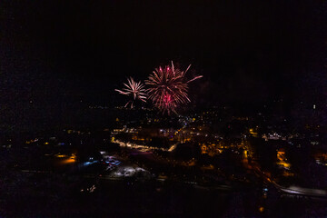 Colorful Explosions of Festive Fireworks Illuminate the Night Sky Valmiera. Colorful exploding...