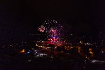 Colorful Explosions of Festive Fireworks Illuminate the Night Sky Valmiera. Colorful exploding...