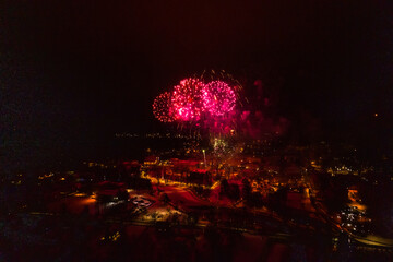 Colorful Explosions of Festive Fireworks Illuminate the Night Sky Valmiera. Colorful exploding...