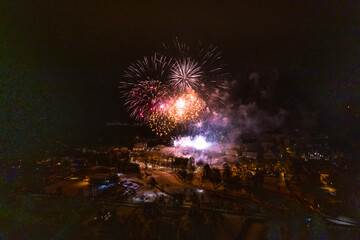 Colorful Explosions of Festive Fireworks Illuminate the Night Sky Valmiera. Colorful exploding...