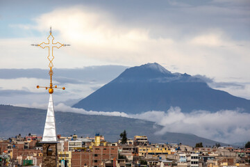 Buildings, spire and volcano, Riobamba, Ecuador
