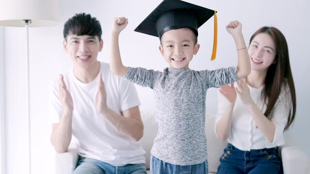 Parent congratulates  child on graduating from kindergarten ,Children graduate, Parent's love, kid graduation succeed concept