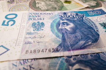 Close up on 50 PLN Polish money banknote Poland economic situation illustrative concept money detail background 