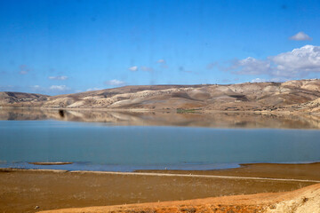 Fototapeta na wymiar Train journey in Morocco (Fez to Oujda). Landscape seen from the train window