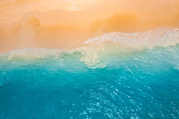 Ingelijste posters Relaxing aerial beach scene, summer vacation holiday. Blue waves surf crash amazing ocean lagoon sea sandy shore coastline. Tranquil aerial drone top view. Peaceful bright beachfront seaside landscape © icemanphotos