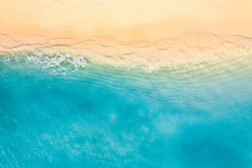 Fototapeten Relaxing aerial beach scene, summer vacation holiday. Blue waves surf crash amazing ocean lagoon sea sandy shore coastline. Tranquil aerial drone top view. Peaceful bright beachfront seaside landscape © icemanphotos