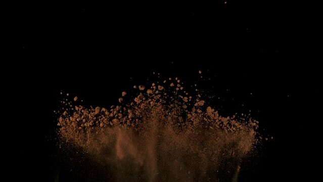 Super Slow Motion Shot of Soil Explosion Isolated on Black Background at 1000fps.