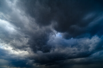 storm sky, dark dramatic clouds during thunderstorm, rain and wind, extreme weather, abstract...