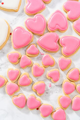 Heart-shaped sugar cookies with royal icing