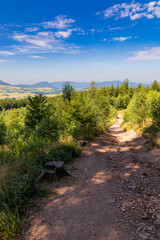 Beautiful green yellow and blue landscape in mountains seen from long and steep mountain trail