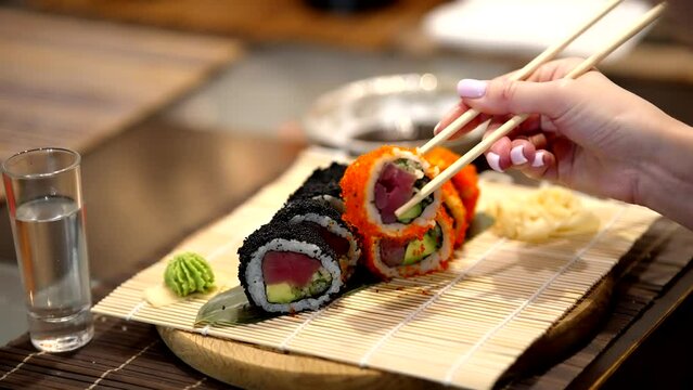 Chopsticks for sushi in Japan . Sushi Maki rolls