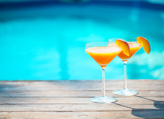 Champagne glasses with peach Bellini cocktail