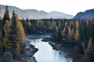 Mountain landscape in autumn. Early morning by the river.