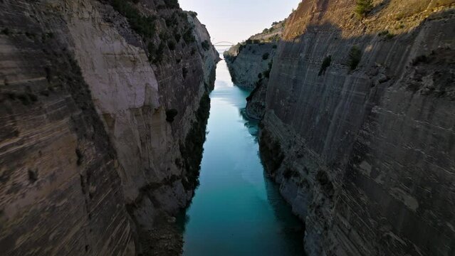 Aerial view of The Corinth Canal in Greece an international maritime hub. An artificial waterway built in Greece connects the Gulf of Corinth with the Aegean Sea.