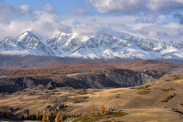 Mountains covered with snow during sunrise. Mountain landscape.